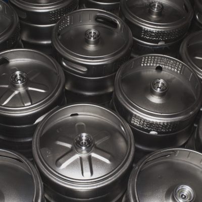 A closeup shot of metal beer kegs
